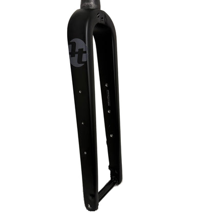 Tout Terrain Gravel Fork carbon fork leg with three replaceable bottle bosses and Tout Terrain logo